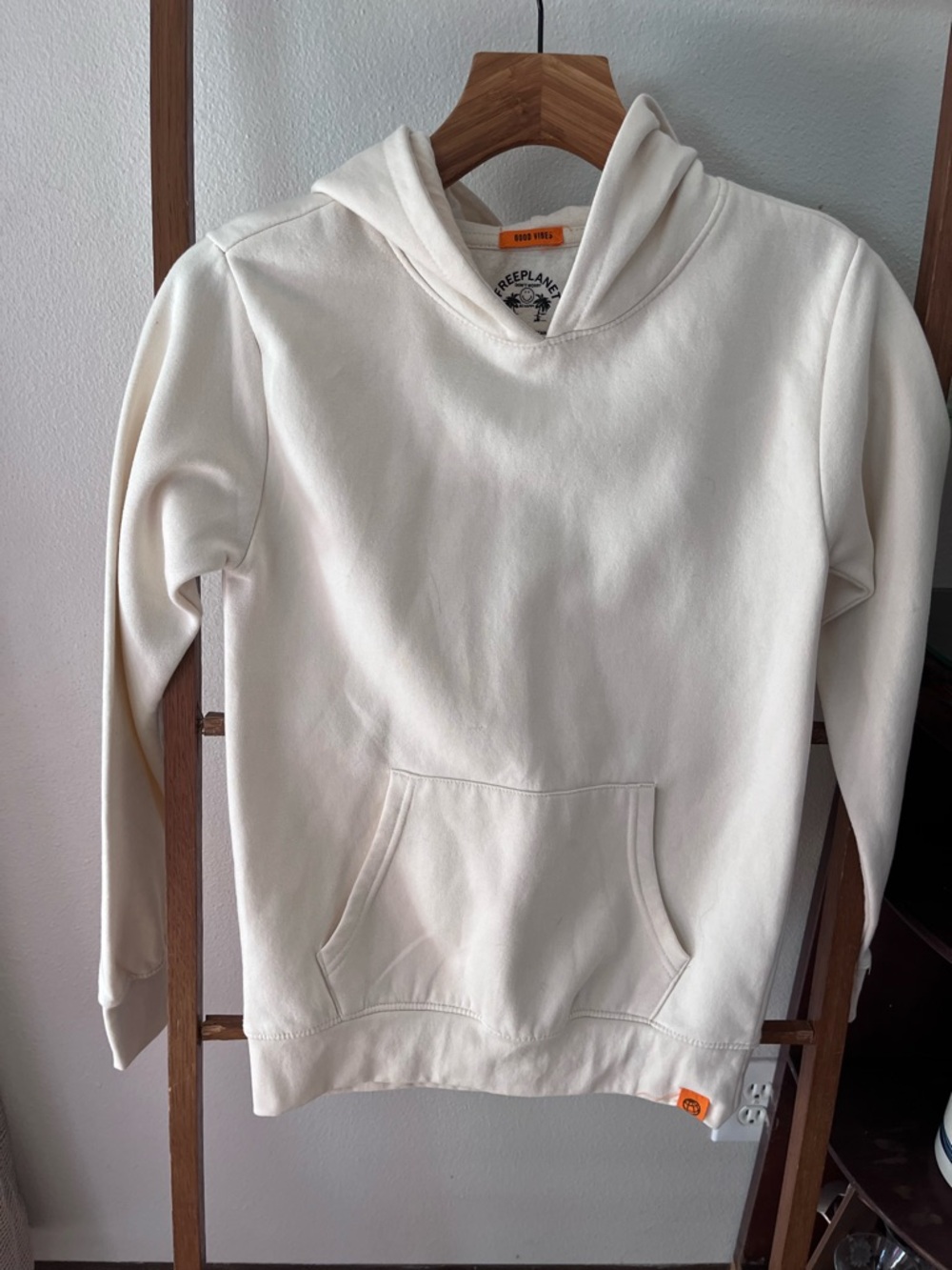 Free Planet Cream Hoodie with 'Good Vibes' Accent